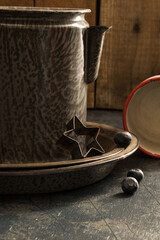 Rustic red, white, and blue kitchen ware. Rustic star cookie cutter. Empty cup.