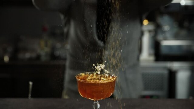 The bartender decorates a cocktail. Macro photography
