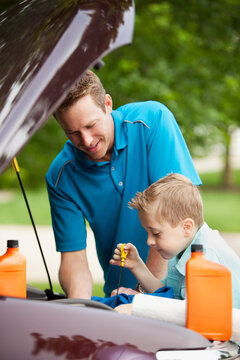Father: Boy Checking Engine Oil Level