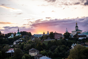 old white-stone temples against the backdrop of sunset