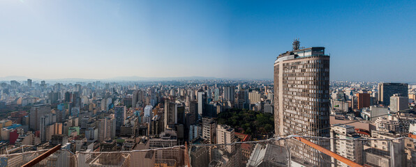Urban aerial panorama of São Paulo in a sunny day with blue sky. View from Copan building.