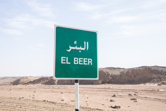 Road sign showing the name of a town called beer