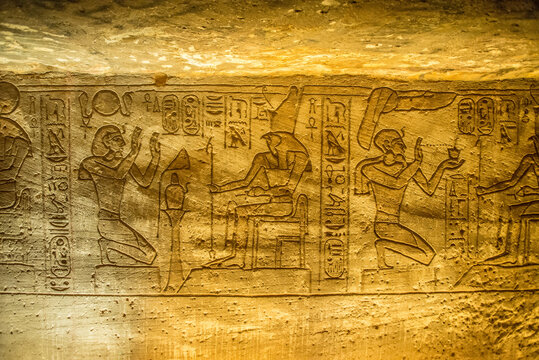 Carvings in stone wall depicting after life for Egyptian royalty.