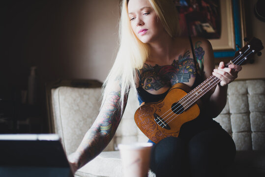 Musician with laptop and ukelele