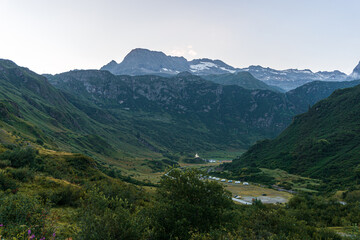 The glaciers, mountains and meadows of the alta val formazza at dawn, during a summer day, near the town of Riale, Italy - July 2020.