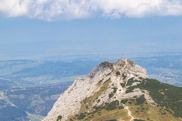 Fototapeta na wymiar Giewont, Tatra Mountains - View on one of most famoust peak in Poland with metal cross on the top