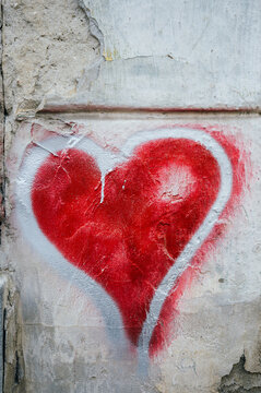Red hearth graffit on old wall
