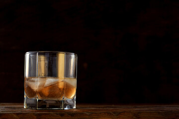 cold alcoholic drink in a glass stock on wooden table