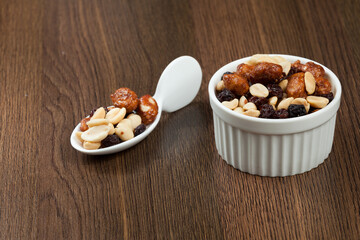 Healthy And Tasty Snack; Mixture of peanuts, raisins, and peanuts Covered With Honey.
