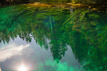 Vivid colors spring water of Kitch-iti-kipi, the Big Spring at Palms Book State Park in Michigan upper peninsula