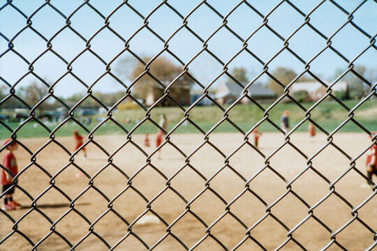 T-Ball throught the Chain Link