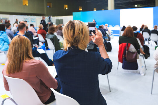 Business woman and people Listening on The Conference. Business women record conference on smartphone
