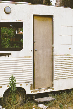 Old and abandoned caravan on forest.