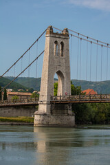 Obraz premium A cable suspension bridge over the Rhone River at La Voulte- Sur- Rhone, France.