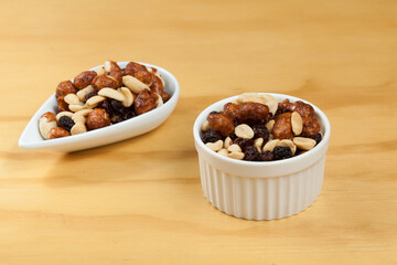 Healthy And Tasty Snack; Mixture of peanuts, raisins, and peanuts Covered With Honey.