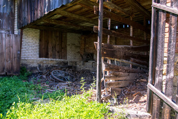 Old dilapidated barn of wood and brick in the village