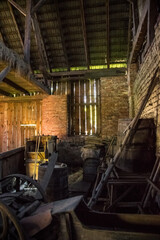 Old dilapidated barn of wood and brick in the village