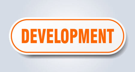 development sign. rounded isolated button. white sticker