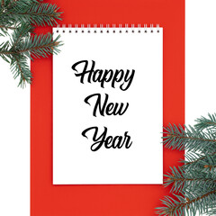 White note book on a red background like frame with the words Happy New Year in the middle.