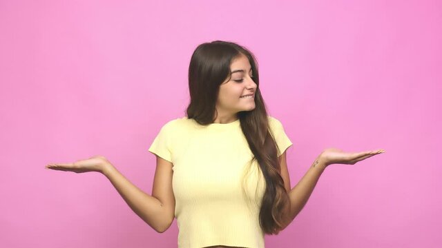 Young caucasian woman confused and doubtful shrugging shoulders to hold a copy space