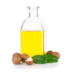 Bottle of nut oil and macadamia nuts with leaves isolated on white