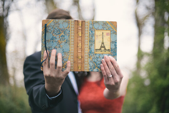 Couple holding their travel book