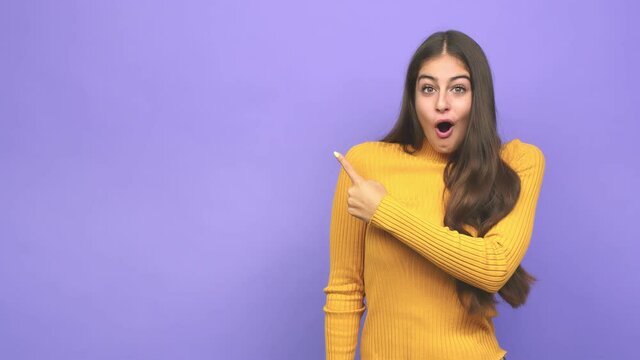 Young caucasian woman pointing to the side