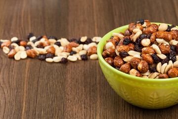 Healthy And Tasty Snack; Mixture of peanuts, raisins, and peanuts Covered With Honey.