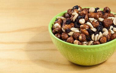 Healthy And Tasty Snack; Mixture of peanuts, raisins, and peanuts Covered With Honey.