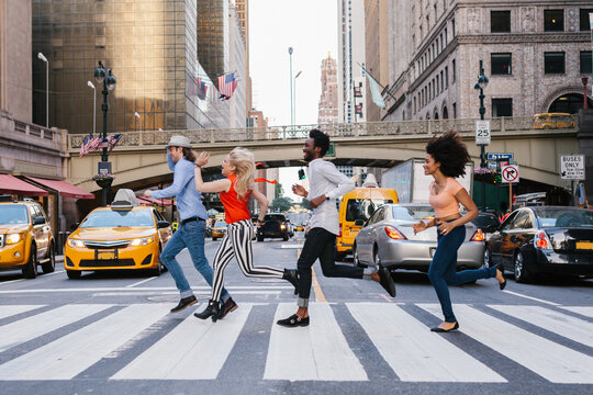 Friends Running in a Crosswalk