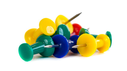 Closeup of Many Colored Thumbtacks on White