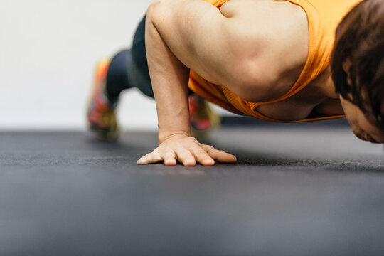 Woman Doinf Pushups In Gym