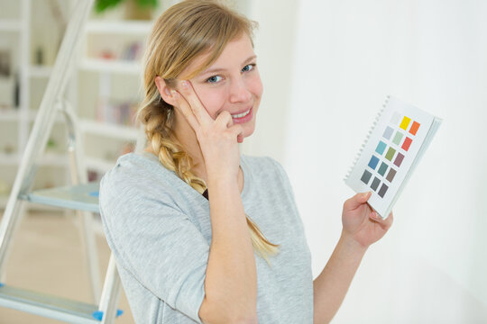 woman holding colour swatches