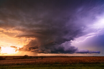 Obraz na płótnie Canvas Stormy sky with dramatic clouds at sunset