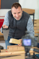 vlogger recording diy repair on camera