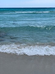 Blue and lazur aquamarine waves on the sand beach in Aiya Napa in Cyprus 