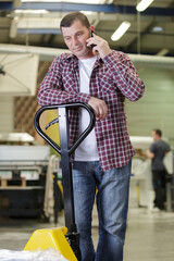 man driving forklift and loading cargo in refrigerated warehousing