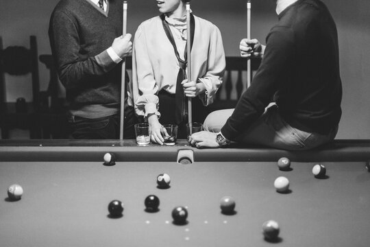Best Friends Playing Billiards in a Pool Table