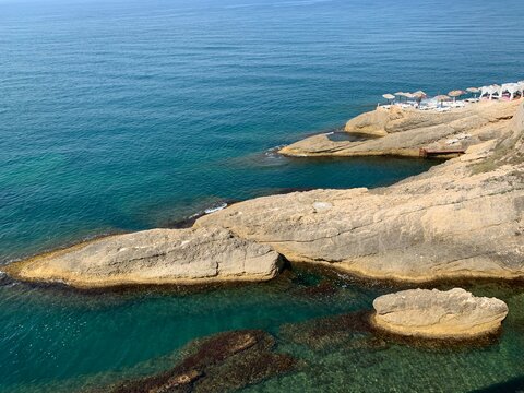 Blue sea and scenic rocks. Adriatic sea. Summer vacation. Rocky beach. Mediterranean coast.