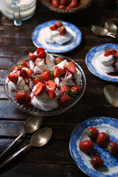 Summer dessert: Strawberries and cream with meringue's.