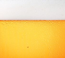 Close up background of beer with bubbles in glass