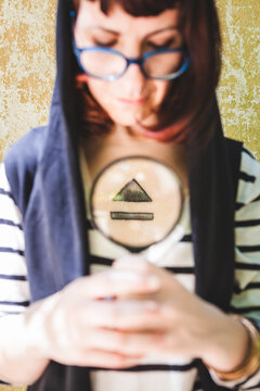 Woman with Magnifier Glass Showing Eject Symbol Tattoo on her Chest