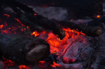 embers burn down in a hardwood fire - 380440855
