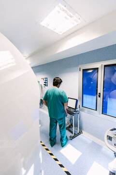 Assistant Checking the Software of the Surgery Robotic Equipment