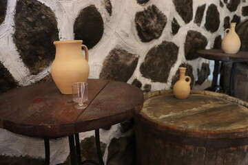 Fototapeta na wymiar handmade jugs with drink on table