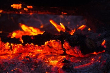 embers burn down in a hardwood fire - 380443442
