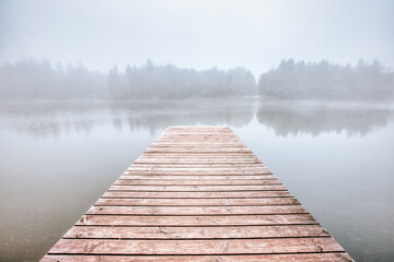 beautiful morning fog on a lake in bavaria