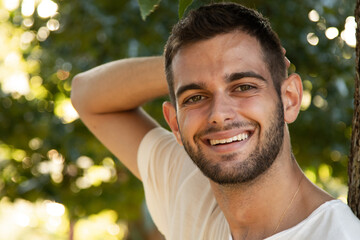 Fototapeta premium portrait of smiling young man with beard