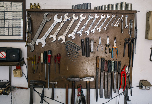 tools hung on wall in workshop