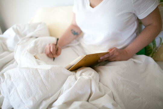 Woman writing in journal